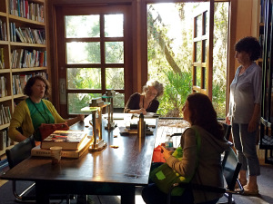 Writers meeting informally in the library at Atlantic Center for the Arts